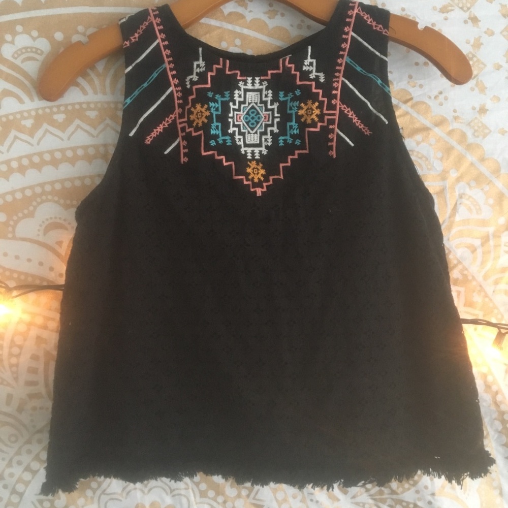 Black shirt, slightly cropped, with front design